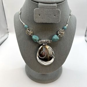 Tibetan Silver pendant with turquoise accents